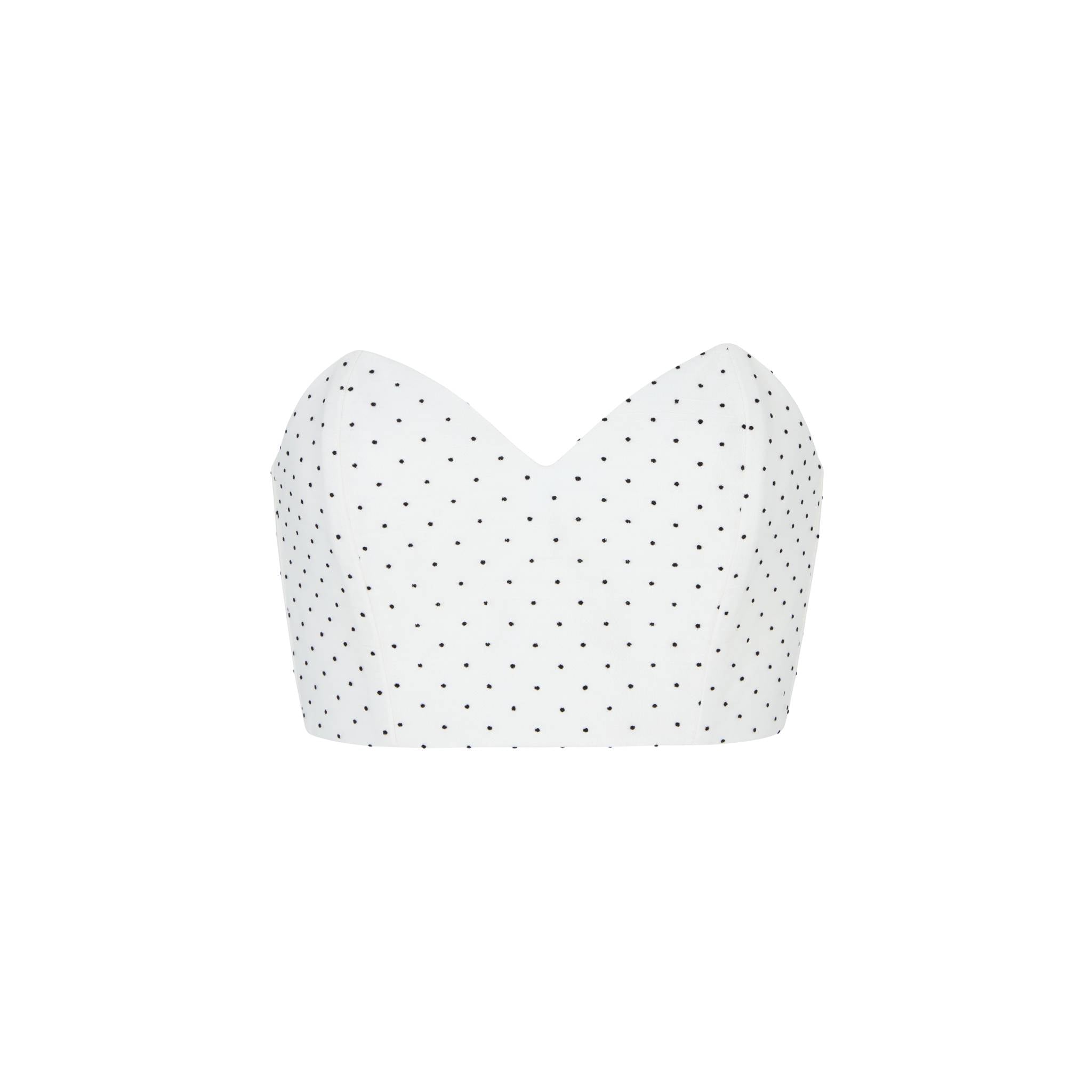White corset top with black polka dots on a white background