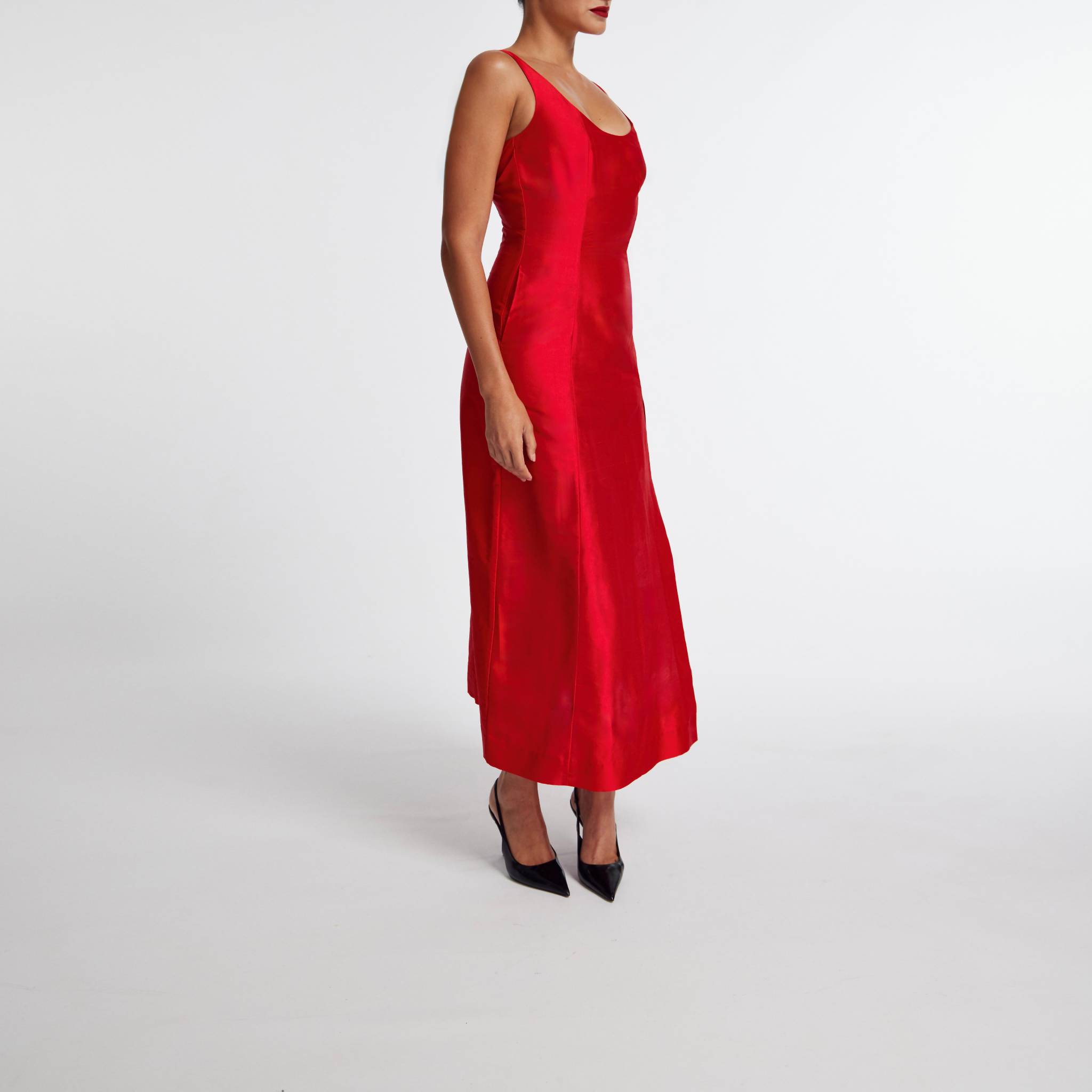 Red dress worn by a person on a white background